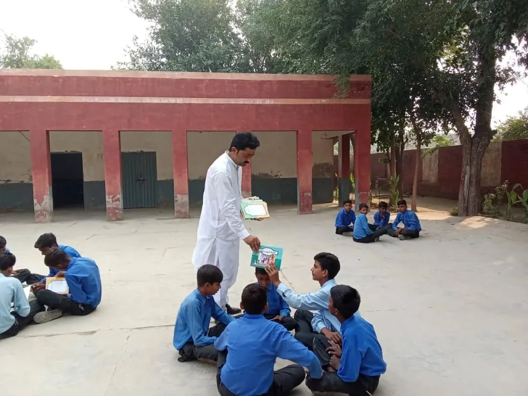 Children studying outdoors at a Bunyad school